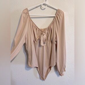 Plus size long sleeve mauve colored leotard.